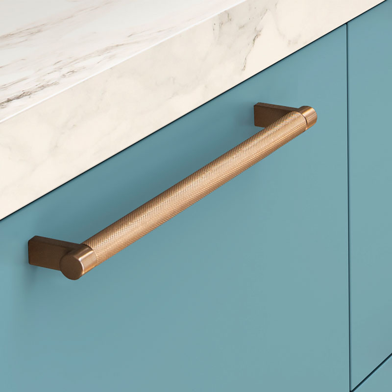 teal cabinet with copper hardware